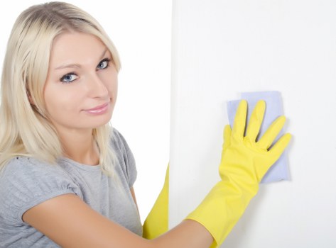 After builders cleaning team vacuuming dust from floors and corners